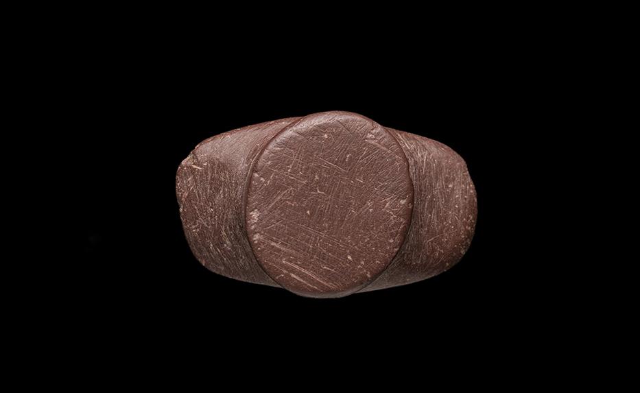 Tembetá tipo discoidal con alas